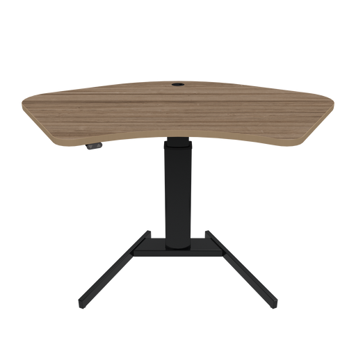 ConSet brand stand-up desk featuring a walnut wood finish tabletop with an ergonomic curve design, supported by a single, sturdy black steel column and a T-shaped base.