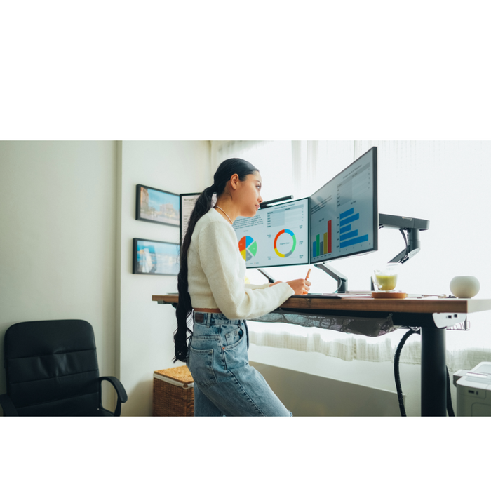 Woman standing at standup desk