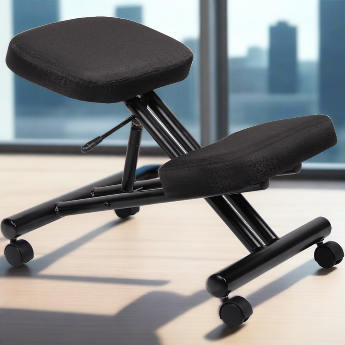 Boss black ergonomic kneeling chair with a sleek metal frame design, featuring a seat and knee pad with thick cushions, equipped with casters for ease of movement, placed in a modern office space with large windows overlooking an urban skyline.