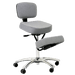 An ergonomic kneeling chair featuring a sleek grey seat, backrest, and knee cushion. The chair has a polished aluminum star base with five caster wheels for easy movement. It includes a gas height adjustment mechanism to customize the seating height and a supportive design that encourages proper posture. 